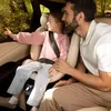 A father and daughter are sitting in a car, looking out the window. Náhľad obrázku produktu