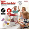 Children are playing with a candy grabber machine at a party. Produktbild-Vorschau