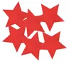 A pile of red star-shaped confetti on a white background. Produktbild-Vorschau