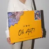 A person is holding a box for a diamond painting kit. Produktbild-Vorschau