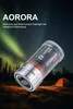 A flashlight is shown in a natural setting with a tent and aurora borealis in the background. Produktbild-Vorschau
