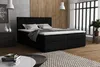 A bedroom scene featuring a black boxspring bed with white bedding, a nightstand with decorative vases, and a framed picture on the wall. Voir les images du produit