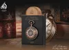 A perfume bottle and its packaging are displayed in a vintage-themed setting with books and a pocket watch. Náhľad obrázku produktu