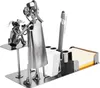 A metal desk organizer shaped like a veterinarian with a dog, holding a pen and sticky notes. Náhľad obrázku produktu