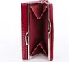 An open red wallet is shown against a white background. Produktbild-Vorschau
