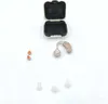 A hearing aid and its accessories are laid out on a white background. Produktbild-Vorschau