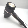 A black Beurer hair dryer with rose gold accents is shown against a white background. Podgląd zdjęcia produktu