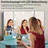 A woman is applying makeup in front of a triple mirror with LED lights, with various makeup products and brushes on the vanity. Voir les images du produit