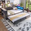 A gray upholstered daybed with a pull-out trundle bed, featuring built-in shelving and LED lighting. Podgląd zdjęcia produktu