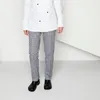 A person wearing a chef's jacket and checkered pants, standing in front of a white background. Produktbild-Vorschau