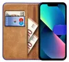 A book-style phone case with a phone inserted, showing cards and banknotes inside. Podgląd zdjęcia produktu