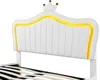 Close-up of a white upholstered headboard with yellow LED lighting and a crown detail. Náhľad obrázku produktu
