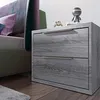 A bedroom scene with a nightstand and bed. Náhľad obrázku produktu