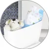 A stuffed dog and a package of baby wipes are in a white bin, possibly on a toilet tank. Produktbild-Vorschau
