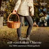 A person holding a wicker basket in an outdoor park setting with autumn leaves on the ground. Produktbild-Vorschau