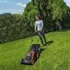 A woman is mowing a lawn with a WORX WG779E Akku-Rasenmäher 40V. Produktbild-Vorschau