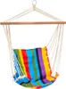 A colorful striped hanging chair suspended from a wooden bar and metal ring. Náhľad obrázku produktu