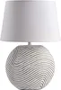 A white table lamp with a textured ceramic base and a white fabric shade, presented against a plain white background. Náhľad obrázku produktu