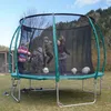 Children playing on a trampoline outdoors with soccer balls. Podgląd zdjęcia produktu