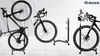 A collage of three different bicycle stands, each holding a bicycle, against a light background. Náhľad obrázku produktu
