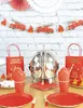 A table set for a firefighter-themed party, with decorations and tableware. Podgląd zdjęcia produktu
