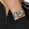 A person wearing a black jacket and an Adidas watch. Podgląd zdjęcia produktu