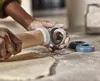 Hands are shown using a rolling pin and cookie cutters on a floured surface. Produktbild-Vorschau