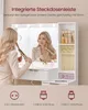 A woman is using a makeup vanity with a lighted mirror and integrated power outlets. Produktbild-Vorschau