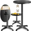 Two black round bistro tables, one folded and leaning against a stand, the other standing and holding drinks. Arrows indicate adjustability. Produktbild-Vorschau