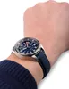 A person's wrist wearing a blue Citizen watch. Náhľad obrázku produktu
