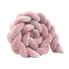 A pink braided pillow on a white background. Produktbild-Vorschau