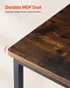 Close-up of the corner of a wooden table with a black metal frame, highlighting the rounded edge and wood grain texture. Voir les images du produit