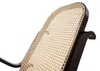 A close-up view of the backrest of a rocking chair, showing the woven rattan material and the dark wood frame. Anteprima dell’immagine prodotto