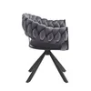 A gray velvet chair with a braided design and black legs, shown from the side against a white background. Voir les images du produit