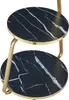 A close-up view of a two-tiered side table with a black marble-look top and gold-colored metal legs. Podgląd zdjęcia produktu