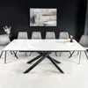 A dining room with a modern extendable table and chairs. Produktbild-Vorschau