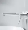 A modern chrome and white wall-mounted faucet over a white sink. Produktbild-Vorschau