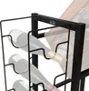 A close-up shot of a black metal wine rack holding multiple wine bottles. Náhled obrázku produktu