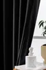 A black curtain is shown hanging in front of a window, with a small white bust and a candle on a book in the foreground. Produktbild-Vorschau