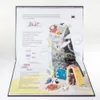 A pop-up book open to a scene with a tower, characters, and text. Voir les images du produit