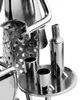 A close-up of a metal figurine depicting a barbecue grill with accessories. Produktbild-Vorschau