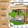 An outdoor pavilion set up in a garden with furniture. Podgląd zdjęcia produktu