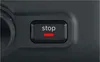 A close-up of a black button with the word 'stop' and a red line underneath. Voir les images du produit