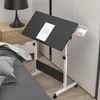 A mobile laptop table is shown next to a bed in a bedroom setting. Produktbild-Vorschau