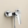 A chrome shower faucet mounted on a light beige wall. Produktbild-Vorschau
