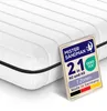 A close-up view of a white mattress with a label attached to it. Produktbild-Vorschau