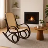 A rocking chair is placed in a cozy living room setting with a fireplace and a small side table. Anteprima dell’immagine prodotto
