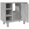 A minimalist cabinet with shelves and doors, made of a grey, concrete-effect material, raised on four cylindrical legs. Produktbild-Vorschau