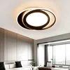 A modern ceiling light fixture in a living room. Náhled obrázku produktu