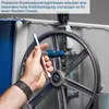 A hand is using a tool on a large wheel mechanism. Produktbild-Vorschau
